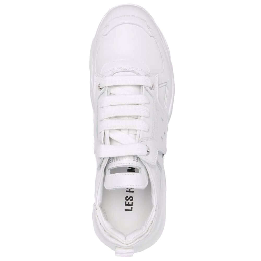 Top view of Les Hommes white calfskin men's sneaker with distinct black nylon band, showcasing Italian craftsmanship and style.