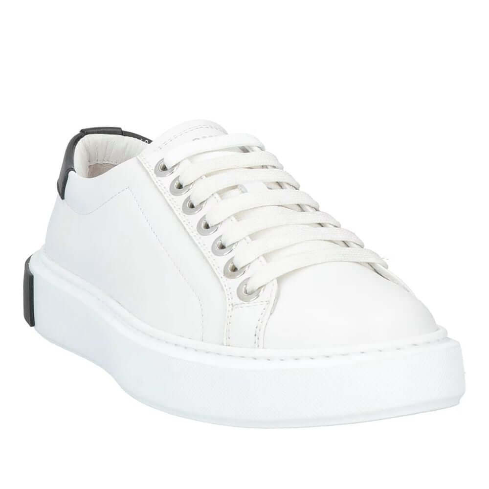 Les Hommes white calfskin men's sneaker with silver logo, black heel counter, and white rubber sole.