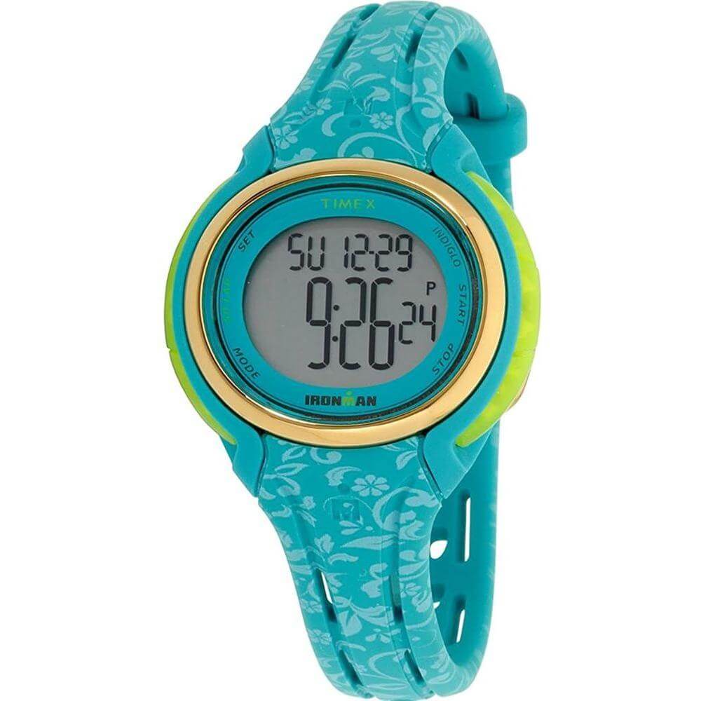 Timex light blue synthetic watch with digital quartz mechanism, plastic case, turquoise silicone bracelet, gray dial, and floral design.