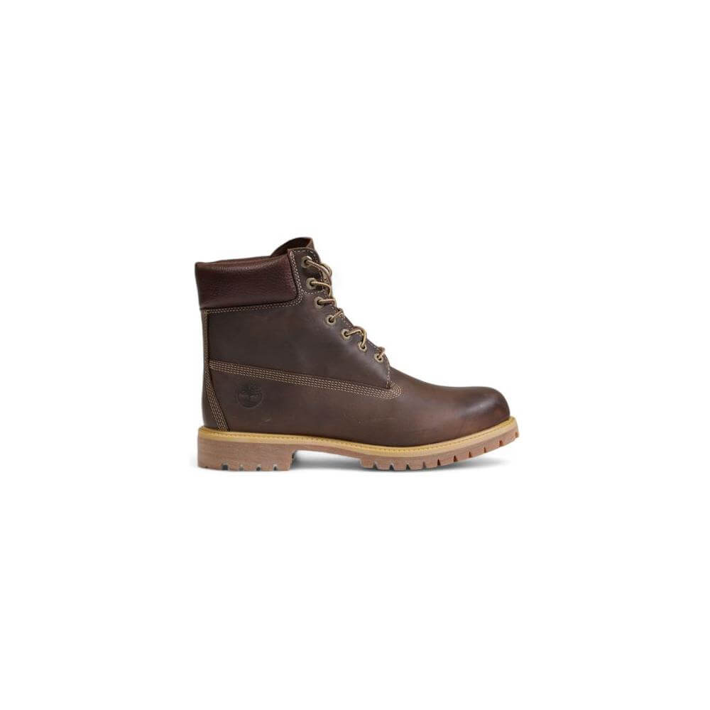 Timberland brown leather boot with lace-up design and waterproof feature, ideal for outdoor activities and harsh weather.