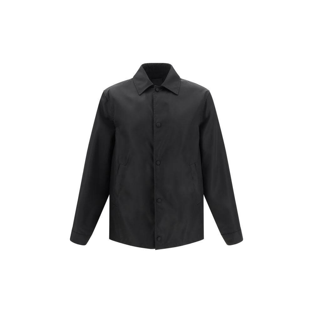 Givenchy oversized shirt with classic collar, snap-button closure, and brand monogram on back, offering a modern, casual style.