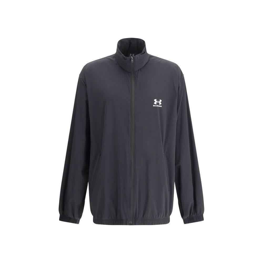 Black jacket with front zipper and collar, featuring a logo on the chest, long sleeves, and an elasticized hem.