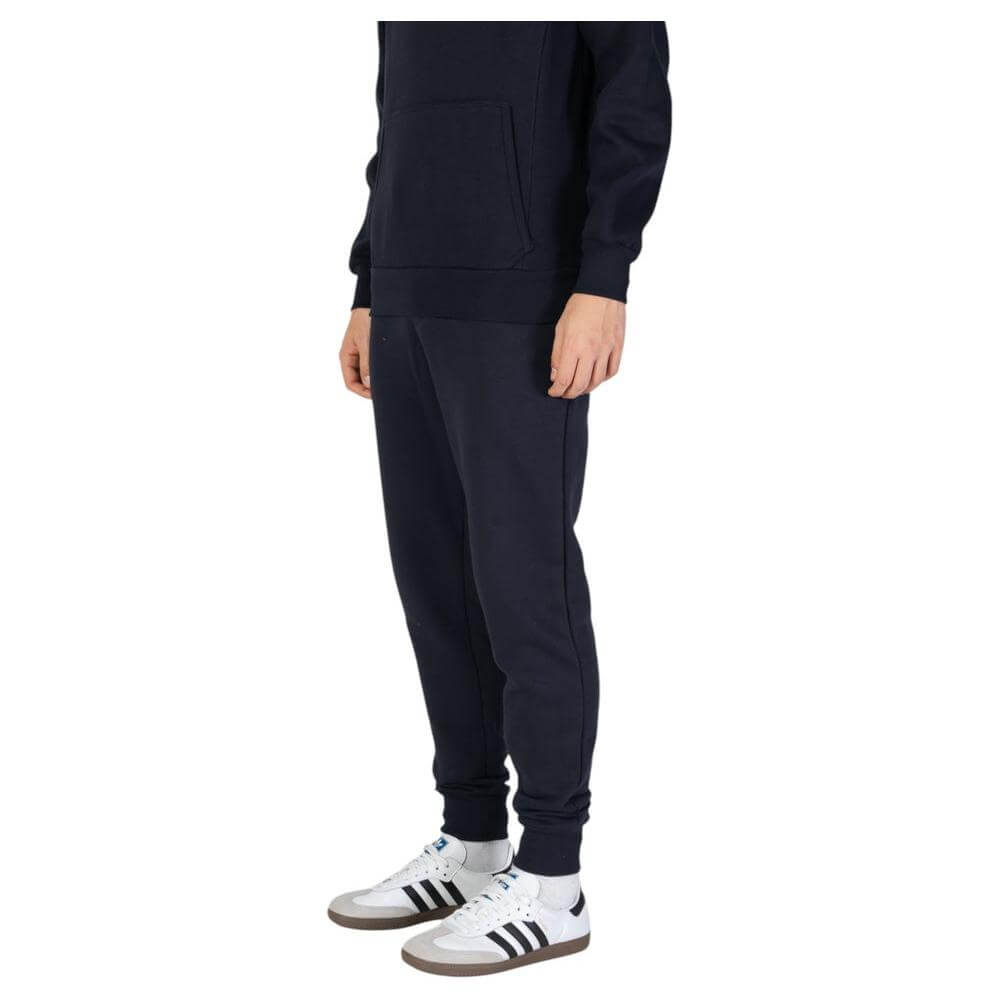 Men's black joggers paired with casual sneakers, featuring a comfortable and stylish fit perfect for fall and winter fashion.