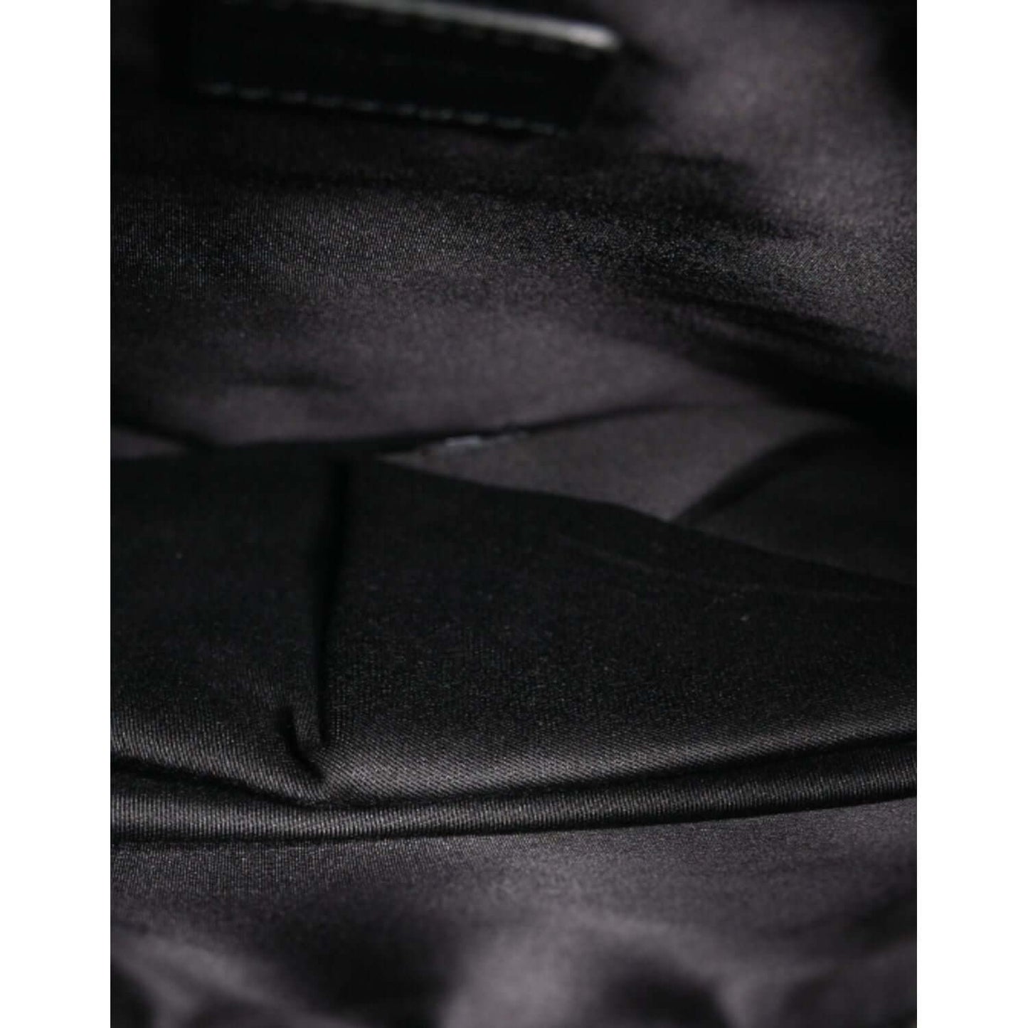 Black interior lining of Dolce & Gabbana Panda Pattern Clutch showing nylon material and craftsmanship details
