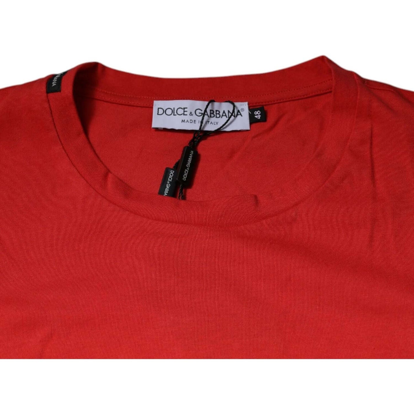 Dolce & Gabbana red cotton crew neck t-shirt with DG logo detail, short sleeves, regular fit, made in Italy, product close-up view.