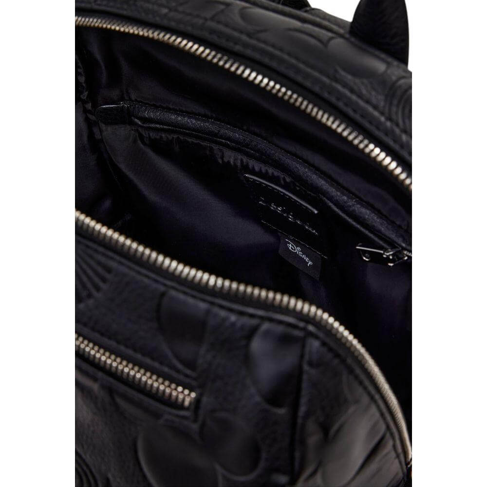 Interior view of Desigual black polyethylene backpack, featuring multiple zip compartments, suitable for women's fashion and spring/summer.