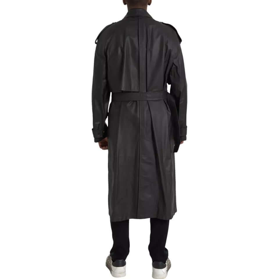 Back view of a Bottega Veneta black leather men's waterproof trench coat with belt, full button closure, worn by a model.