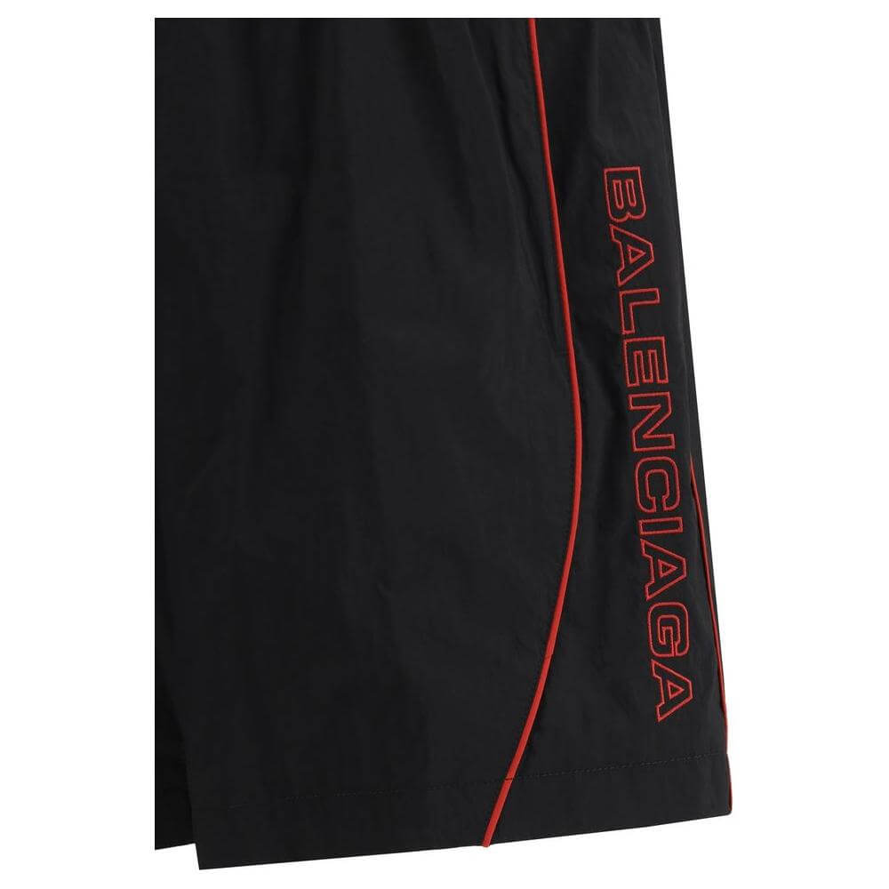 Balenciaga tracksuit shorts with elasticized waistband and monogram design, featuring side welt pockets for a stylish, comfortable fit.