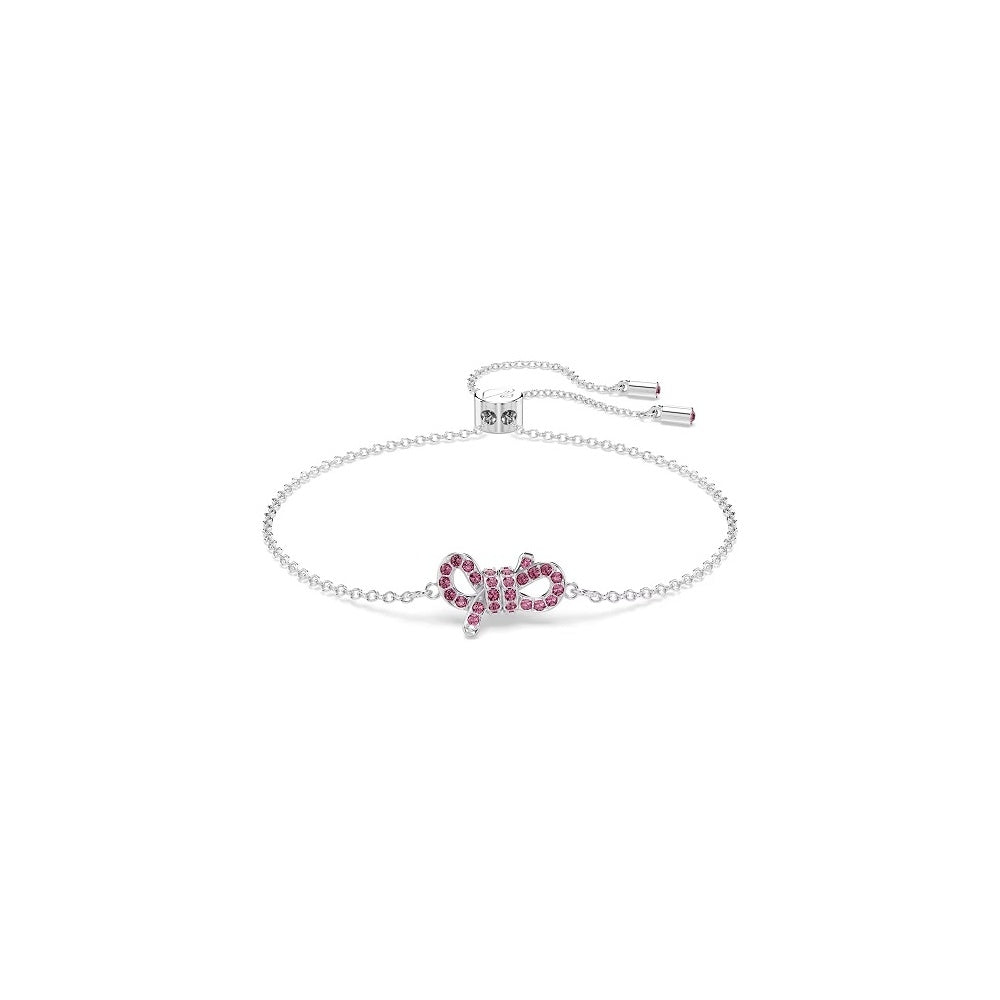 Swarovski bracelet with pink crystal bow on silver chain, elegant adjustable design for ladies, perfect for gifting.