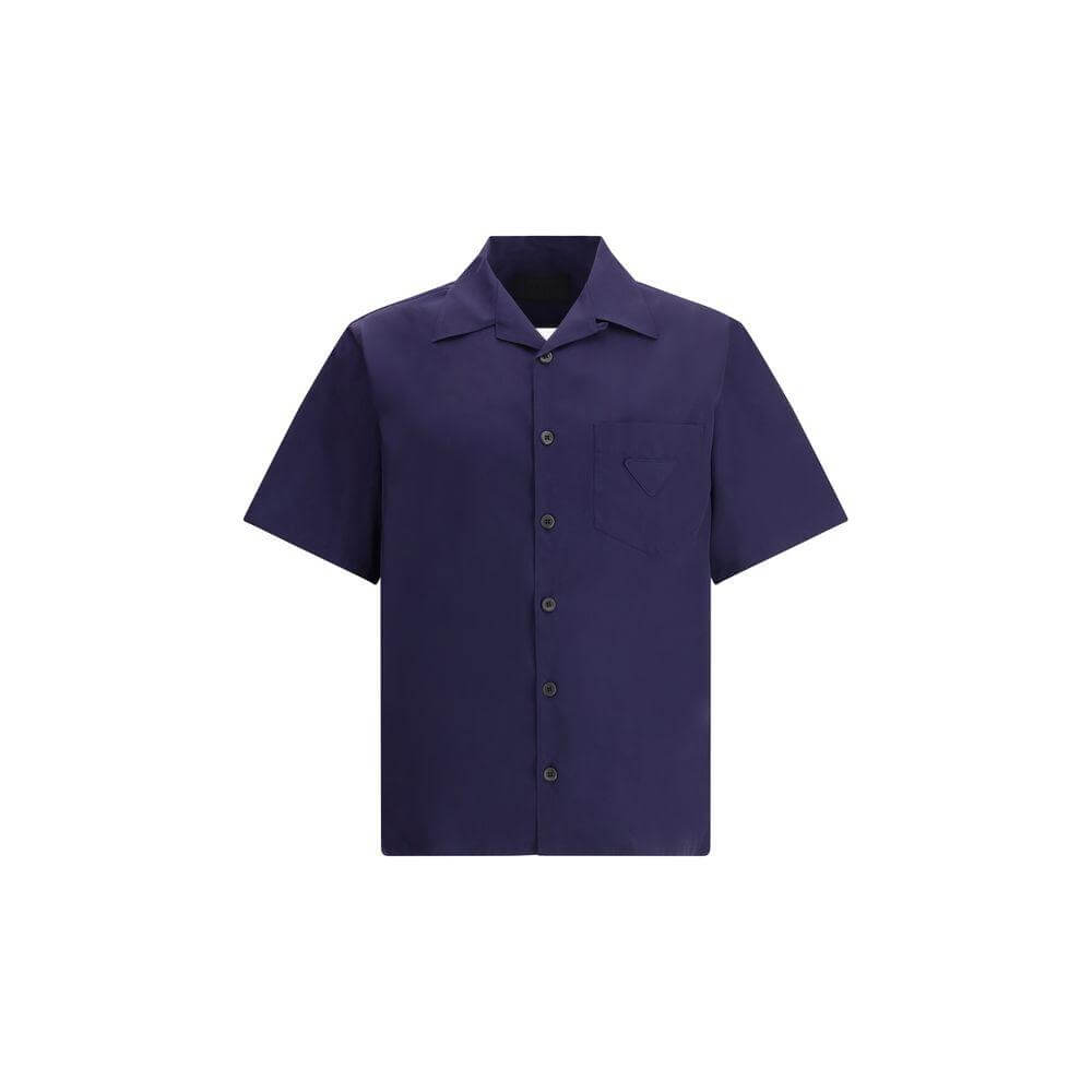Prada short-sleeved cotton shirt with classic collar and front patch pocket, perfect for summer elegance and comfort.