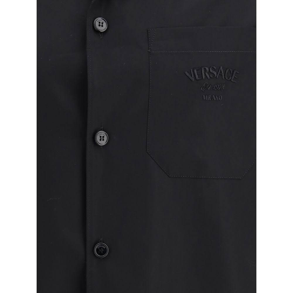 Versace Medusa pattern shirt with classic collar and front pocket featuring iconic logo embroidery, ideal for summer fashion.