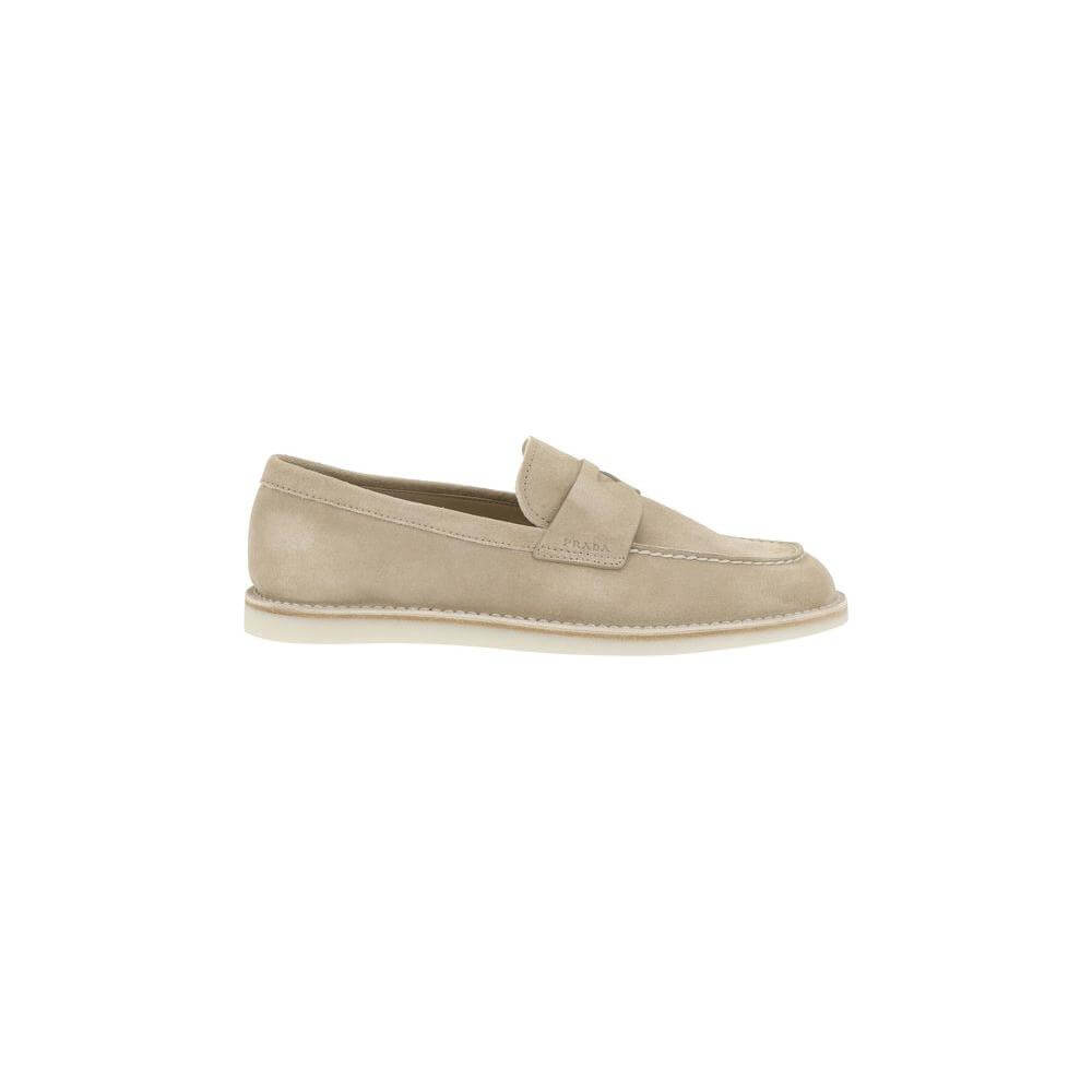Prada suede loafers with almond toe, contrasting flat sole, and logo-embossed insole, for a sophisticated and timeless look.