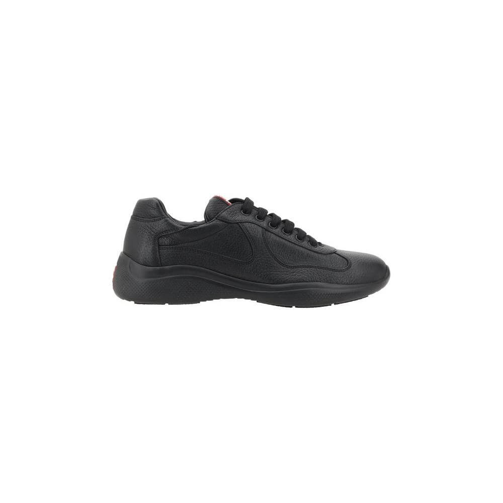 Prada Leather Sneakers with grained texture, front lace-up, round toe, and textured sole, featuring iconic monogram on the tongue.