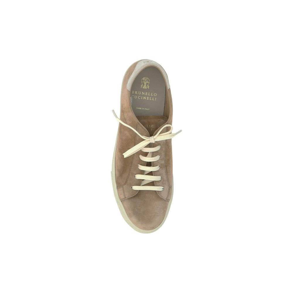 Top view of a Brunello Cucinelli suede calfskin sneaker with round toe and branded insole, featuring lace-up front and heel label.