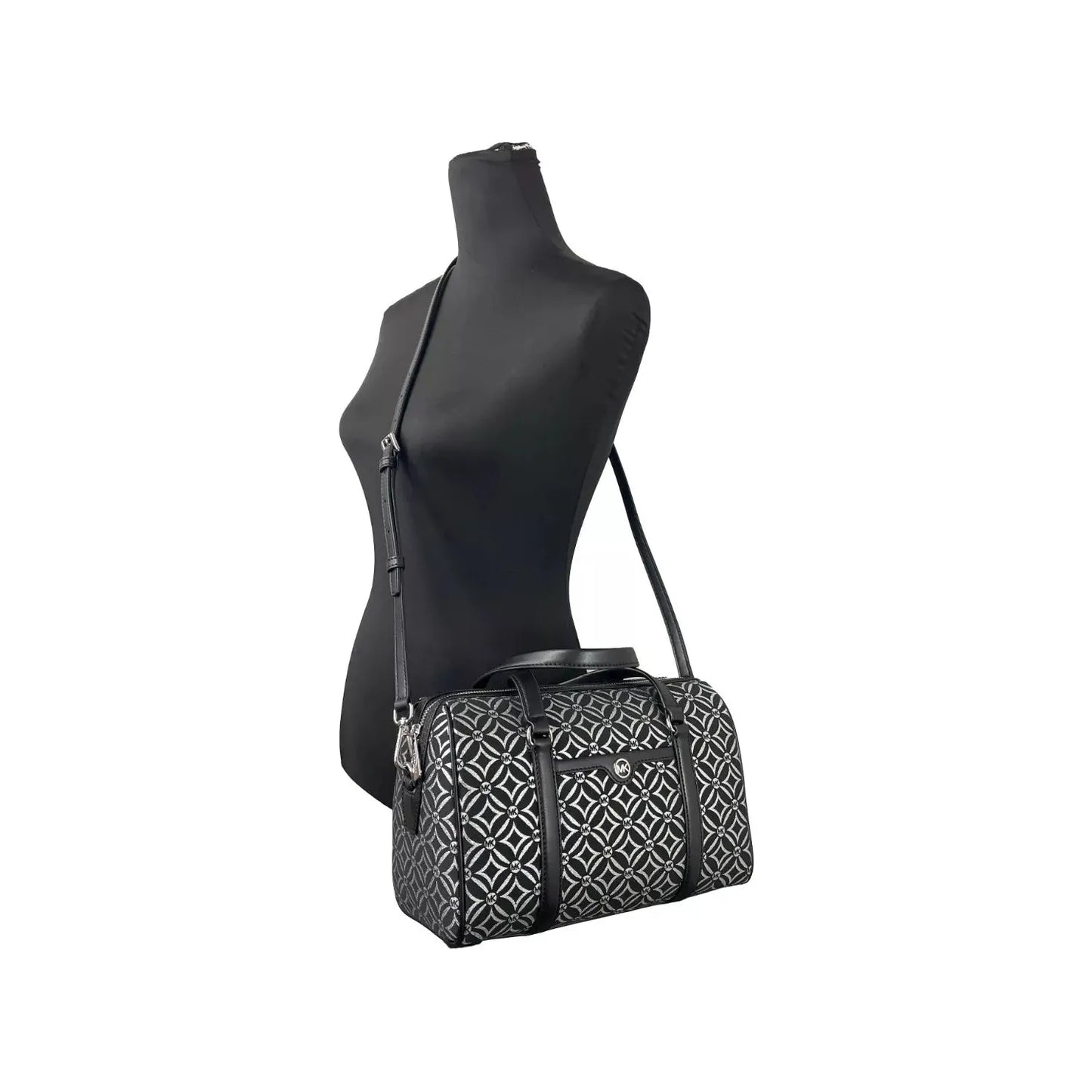 Michael Kors Medium Duffle Crossbody Bag with geometric print on mannequin, leather material, detachable strap, black color, sleek design