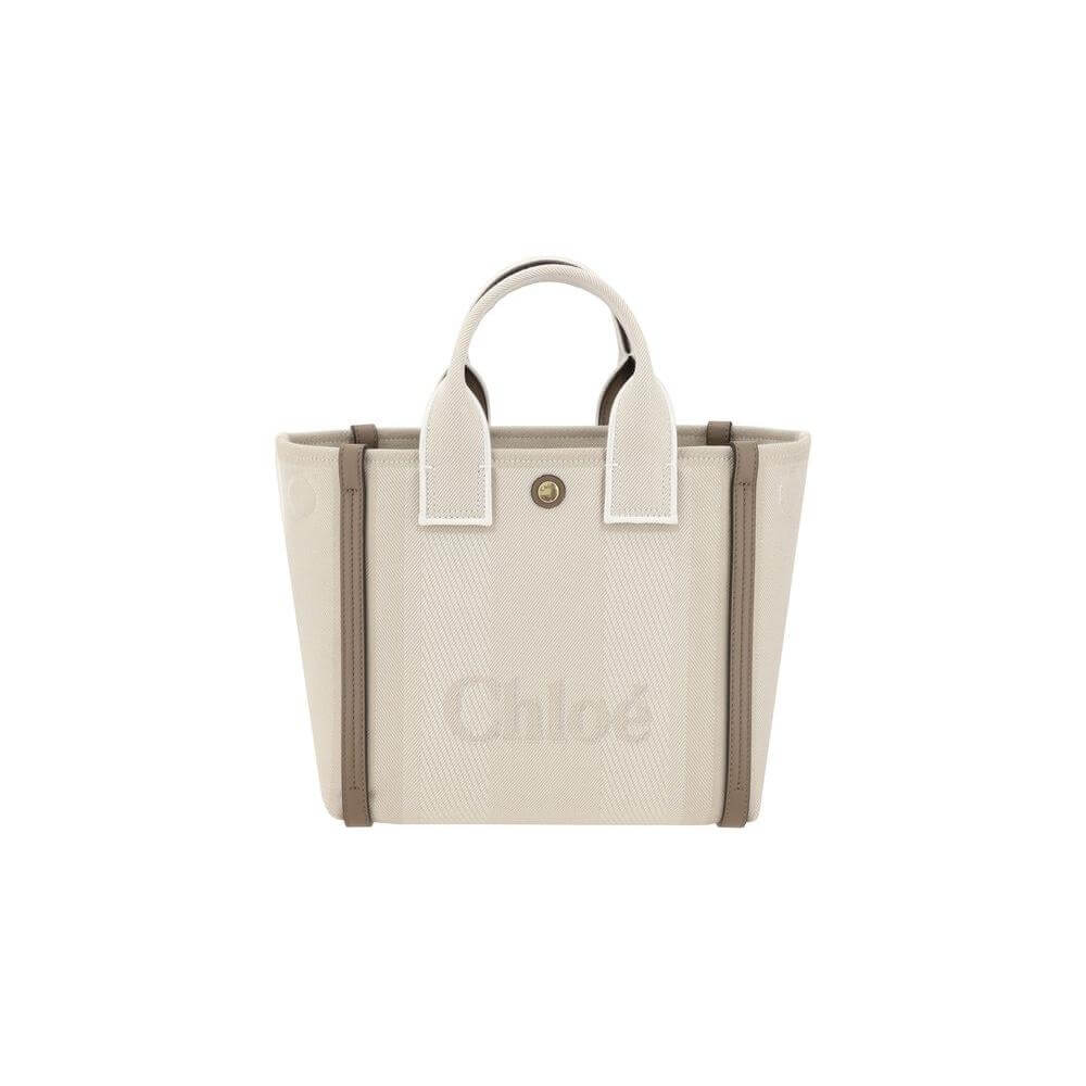 Chloé Carry Tote Bag with cotton fabric and leather accents, featuring adjustable width and multiple carrying options.