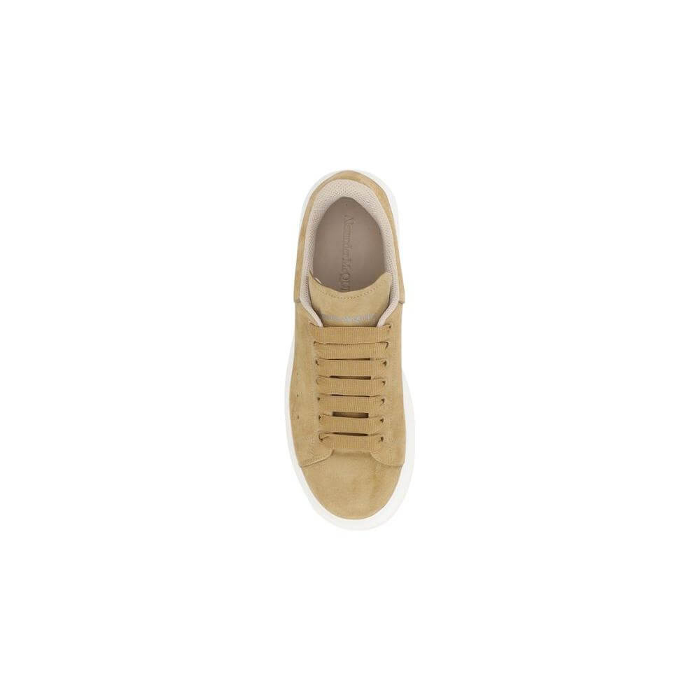 Top view of Alexander McQueen suede leather sneakers with lace-up front and logo details.