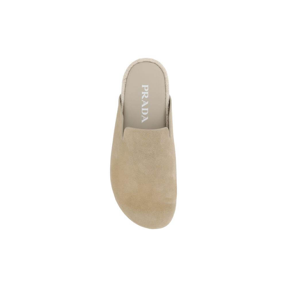 Top view of Prada suede leather Sabots with round toe and engraved logo on insole, highlighting the elegant and sophisticated design.
