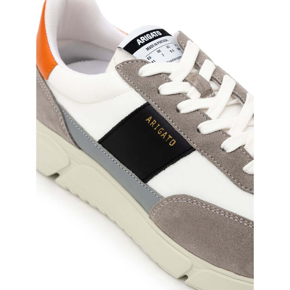Axel Arigato Genesis Vintage Runner sneaker with bicolor fabric and leather, showing side panel and heel tab details.
