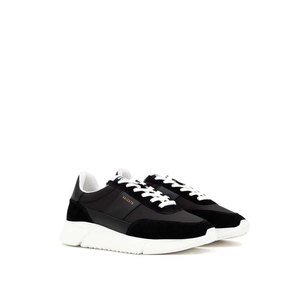Axel Arigato Genesis Vintage Runner black and white sneaker with retro design, LWG-certified leather, and recycled materials.