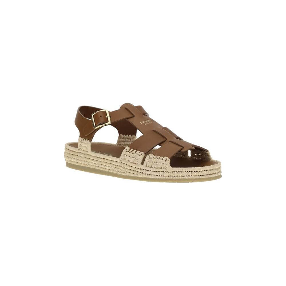 Prada leather and raffia sandals with retro design, adjustable strap, and iconic branding detail on the upper, showcasing elegance and style.