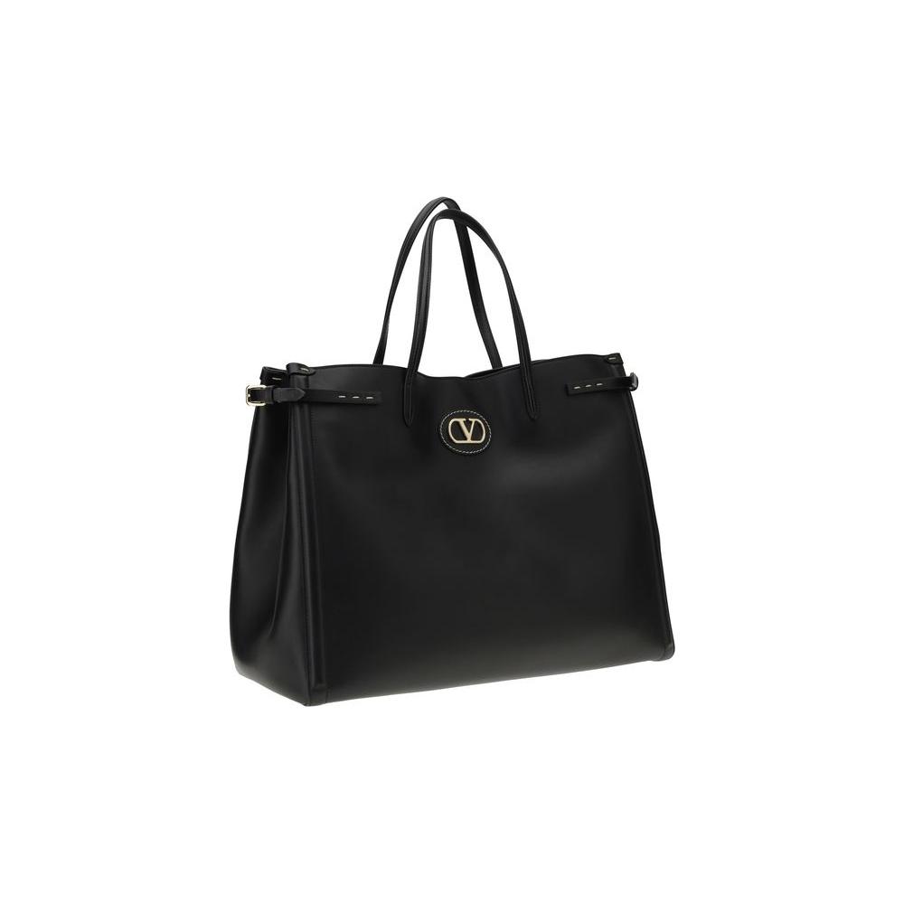 Valentino Garavani Large Antibes Tote Bag in black leather with signature VLogo and gold-finish metallic parts, featuring elegant double handles.