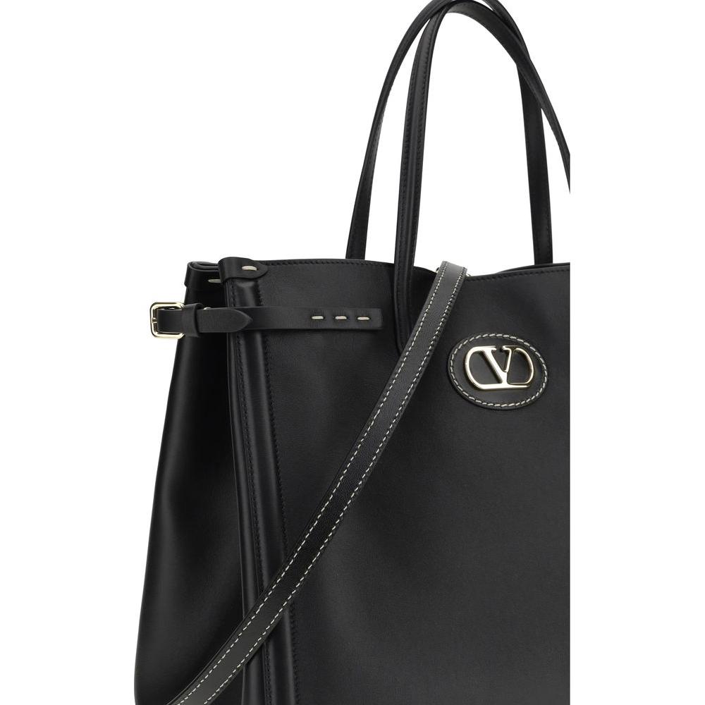 Valentino Garavani Antibes Handbag with side buckles, metallic logo, gold-finish details, and leather strap for sophisticated luxury.