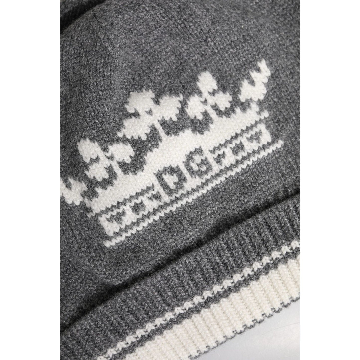Close-up of Dolce & Gabbana gray cashmere beanie with white crown logo detailing.