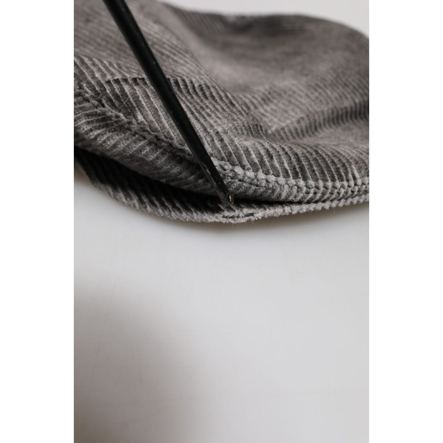 Close-up of Dolce & Gabbana gray cotton newsboy cap with minor brim defect, showcasing classic style and Italian craftsmanship.