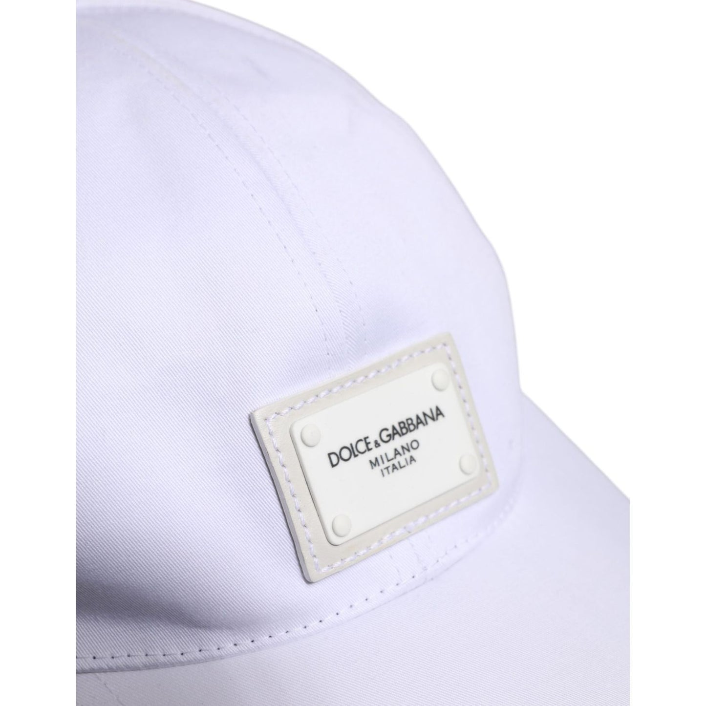 White Dolce & Gabbana baseball cap with DG logo plaque, showing minor top stains, made from cotton and elastane, made in Italy.