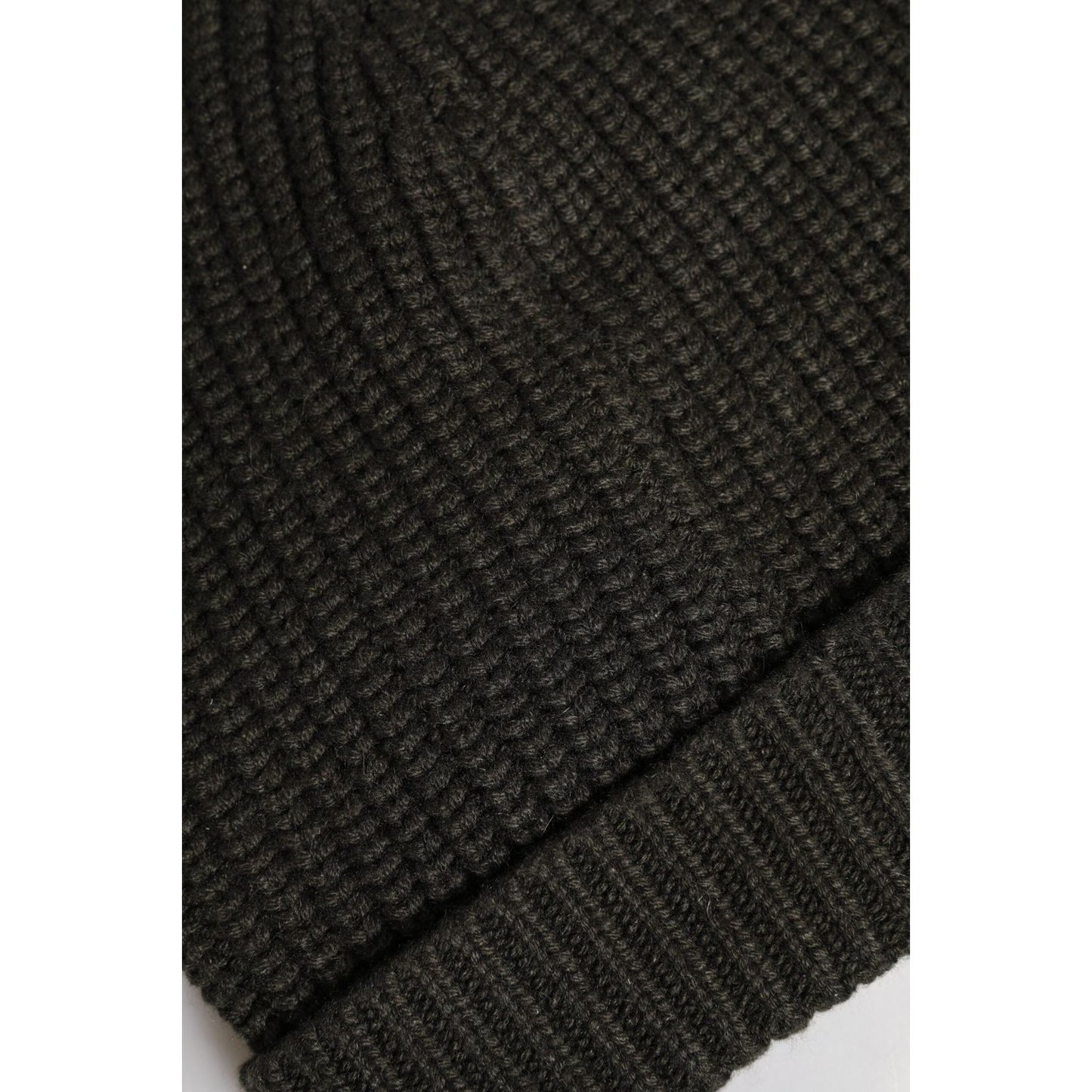 Dolce & Gabbana dark gray knit beanie hat made of 100% cashmere, showcasing texture and craftsmanship, perfect for winter fashion.