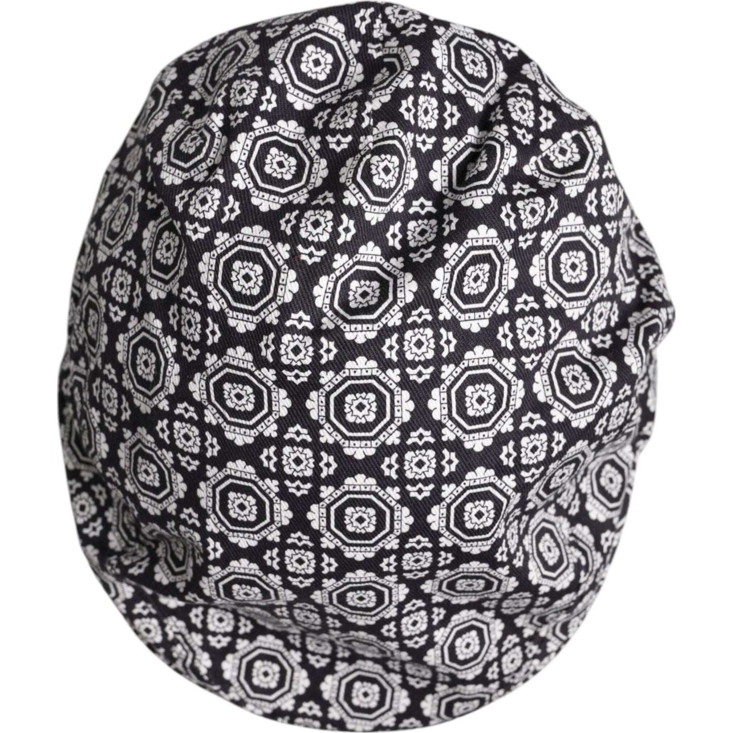 Dolce & Gabbana black and white printed newsboy cap, men's hat made from cotton and elastane with logo details, top view.