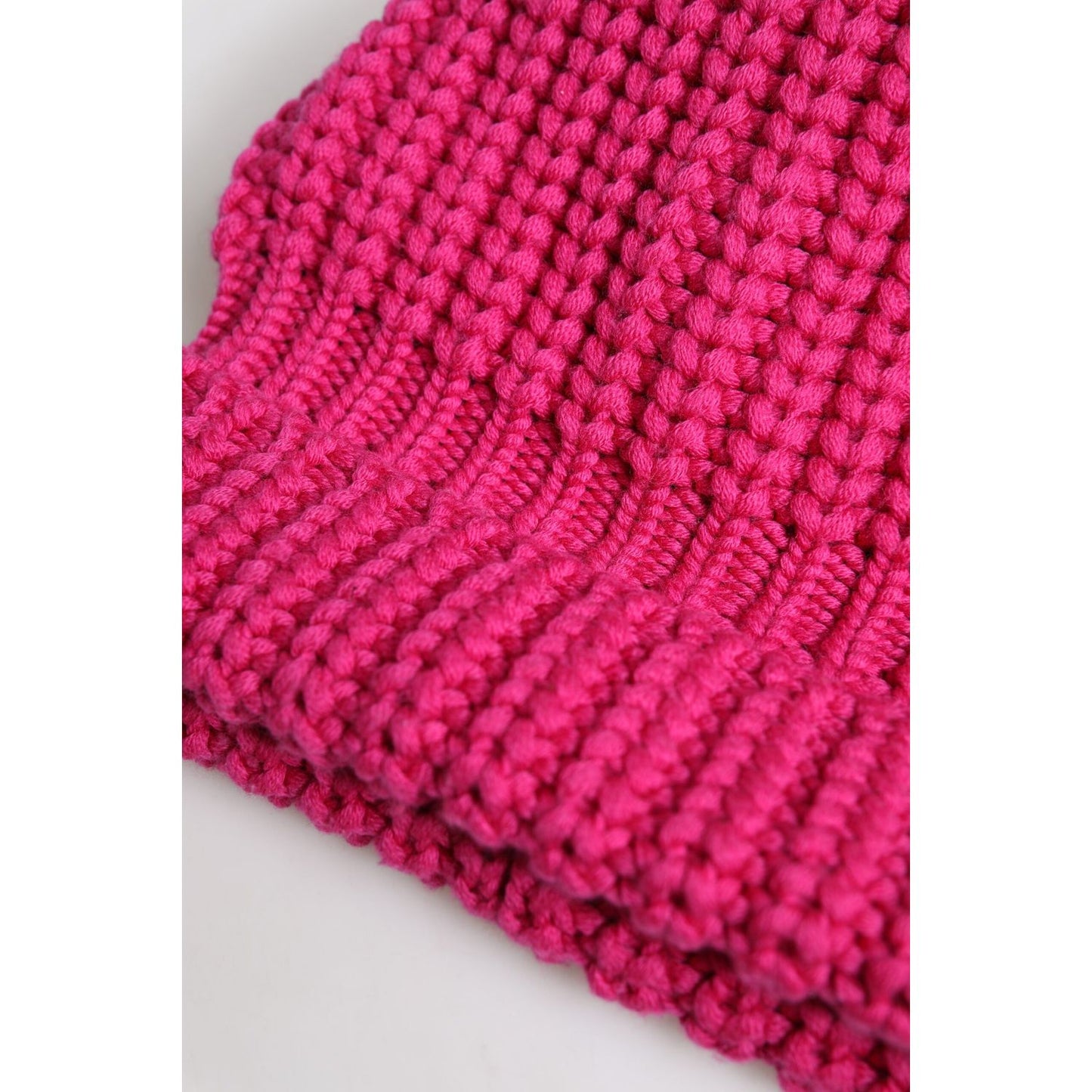 Dolce & Gabbana pink wool winter beanie hat, knitted texture, 100% virgin wool, luxury men's fashion, made in Italy, close-up view.
