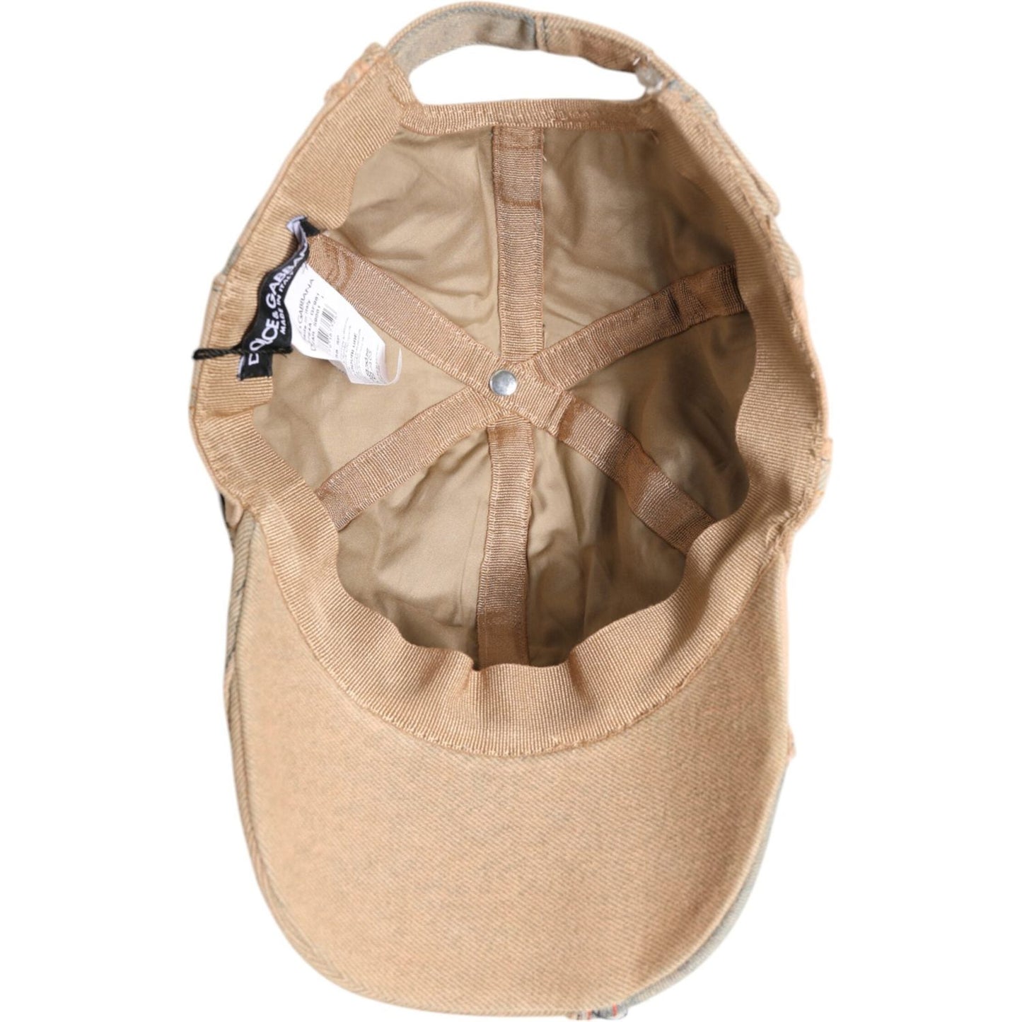 Inside view of a Dolce & Gabbana beige tattered cotton baseball cap with six panels and tags, made in Italy.