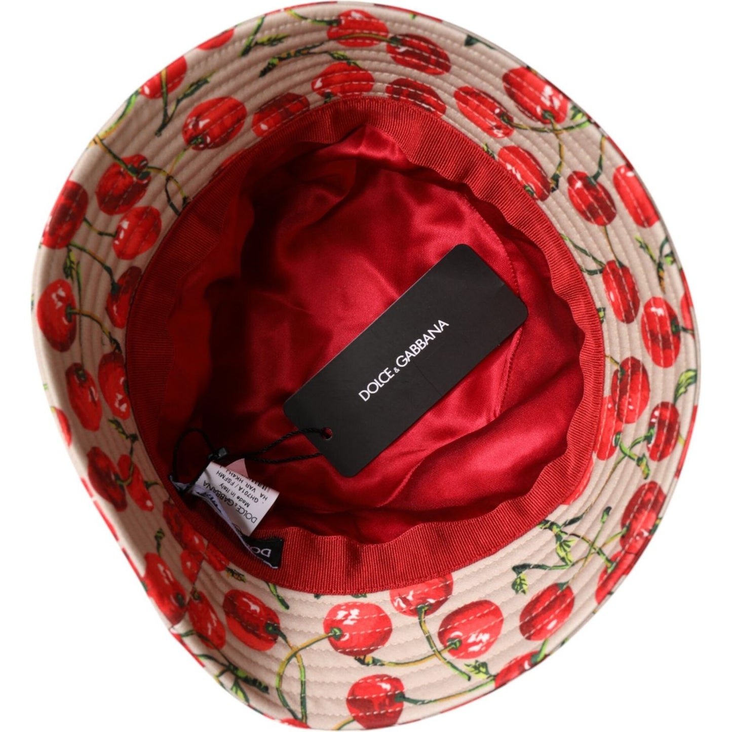 Dolce & Gabbana beige bucket hat with cherry print, red lining, and Dolce & Gabbana label, made of 100% cotton.
