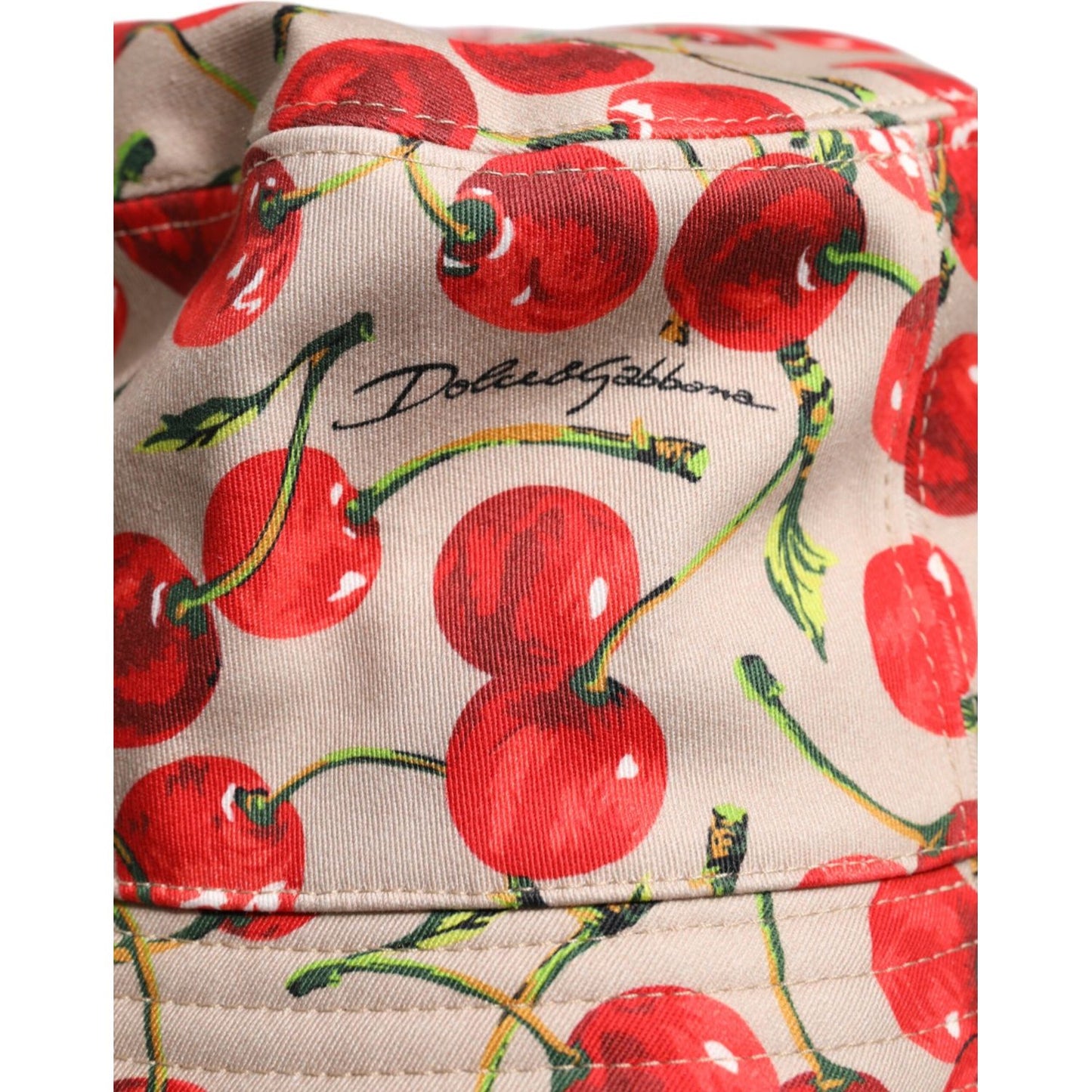 Dolce & Gabbana beige bucket hat with cherry print and logo, made of 100% cotton, wide brim design, perfect for men's fashion.