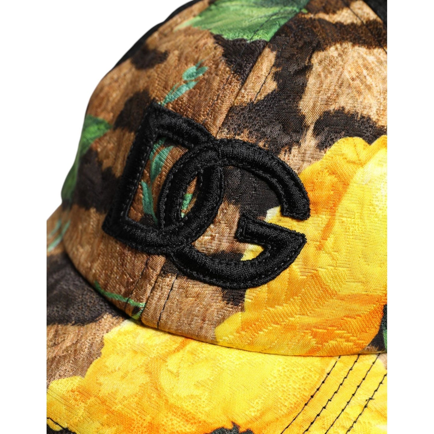 Dolce & Gabbana multicolor baseball cap with DG logo patch, featuring a vibrant floral and abstract pattern. Material: Polyester, Cotton.