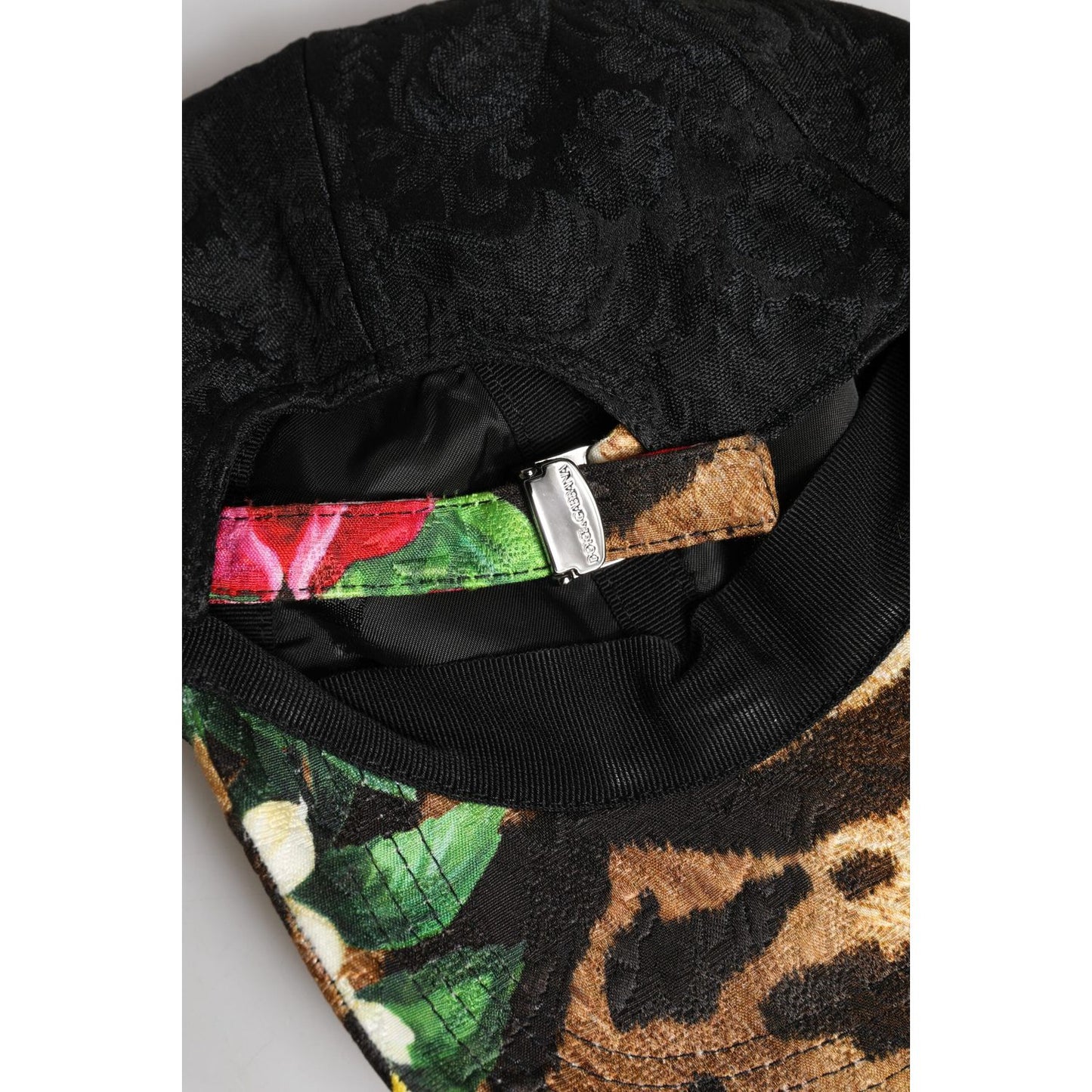 Dolce & Gabbana multicolor DG logo patch baseball cap underside showing adjustable strap and vibrant pattern details.