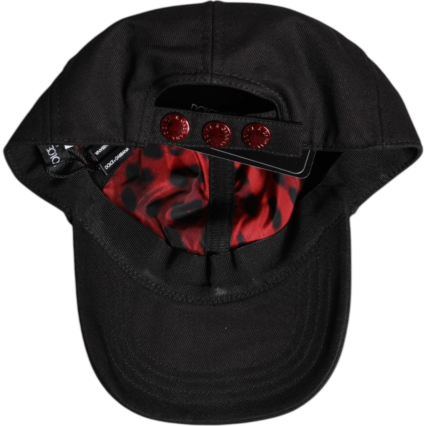Dolce & Gabbana black cotton baseball cap with logo patch, six panels, and interior lining detail. Made in Italy.