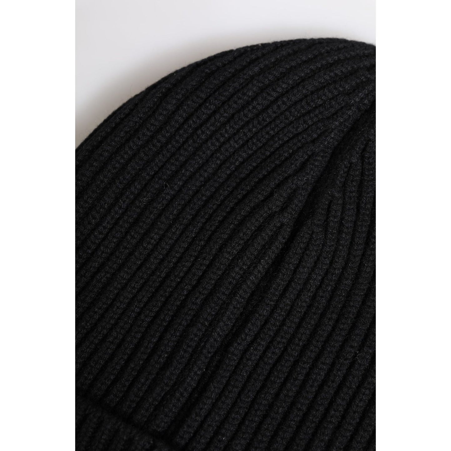 Dolce & Gabbana black cashmere knitted winter beanie hat, close-up view of ribbed texture, men's fashion accessory.