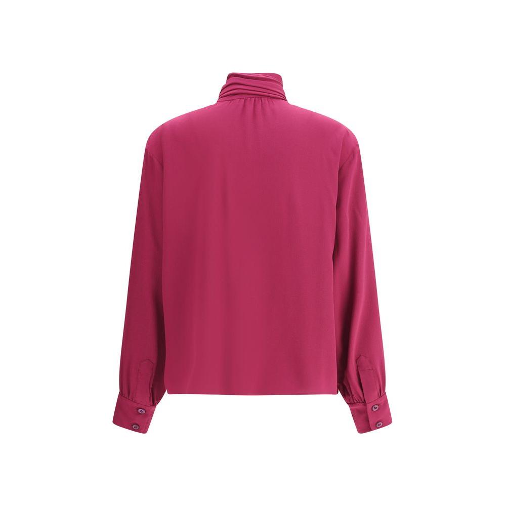 Back view of a pink Prada silk blouse featuring long sleeves and adjustable buttoned cuffs.