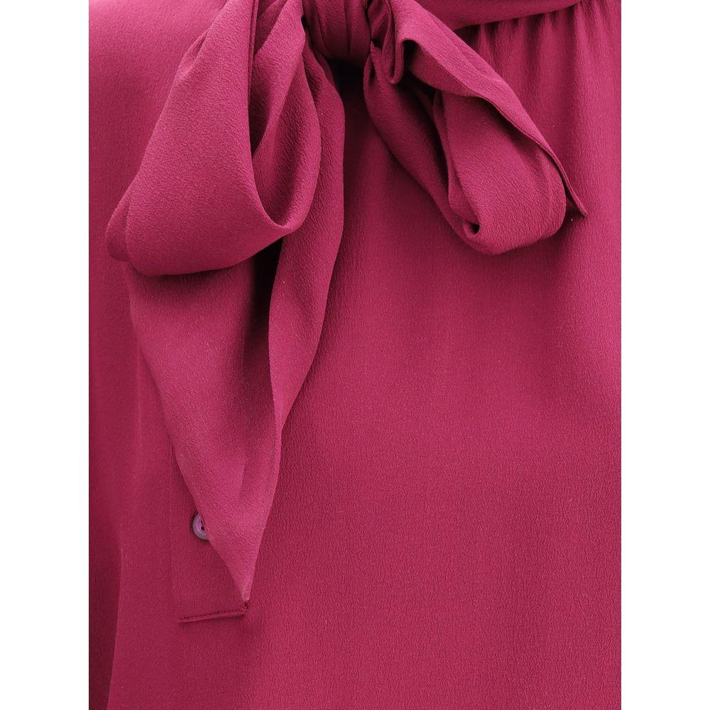 Prada silk blouse with a self-tie sash collar in vibrant pink, showcasing elegant design and luxurious fabric for a chic look.