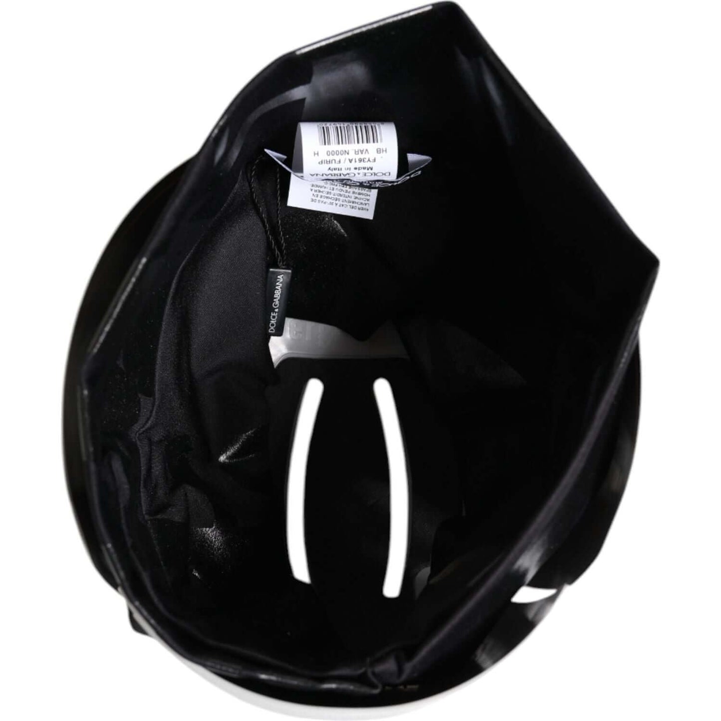 Interior view of Dolce & Gabbana black nylon stretch headband with DG logo, showing label and material details, made in Italy.