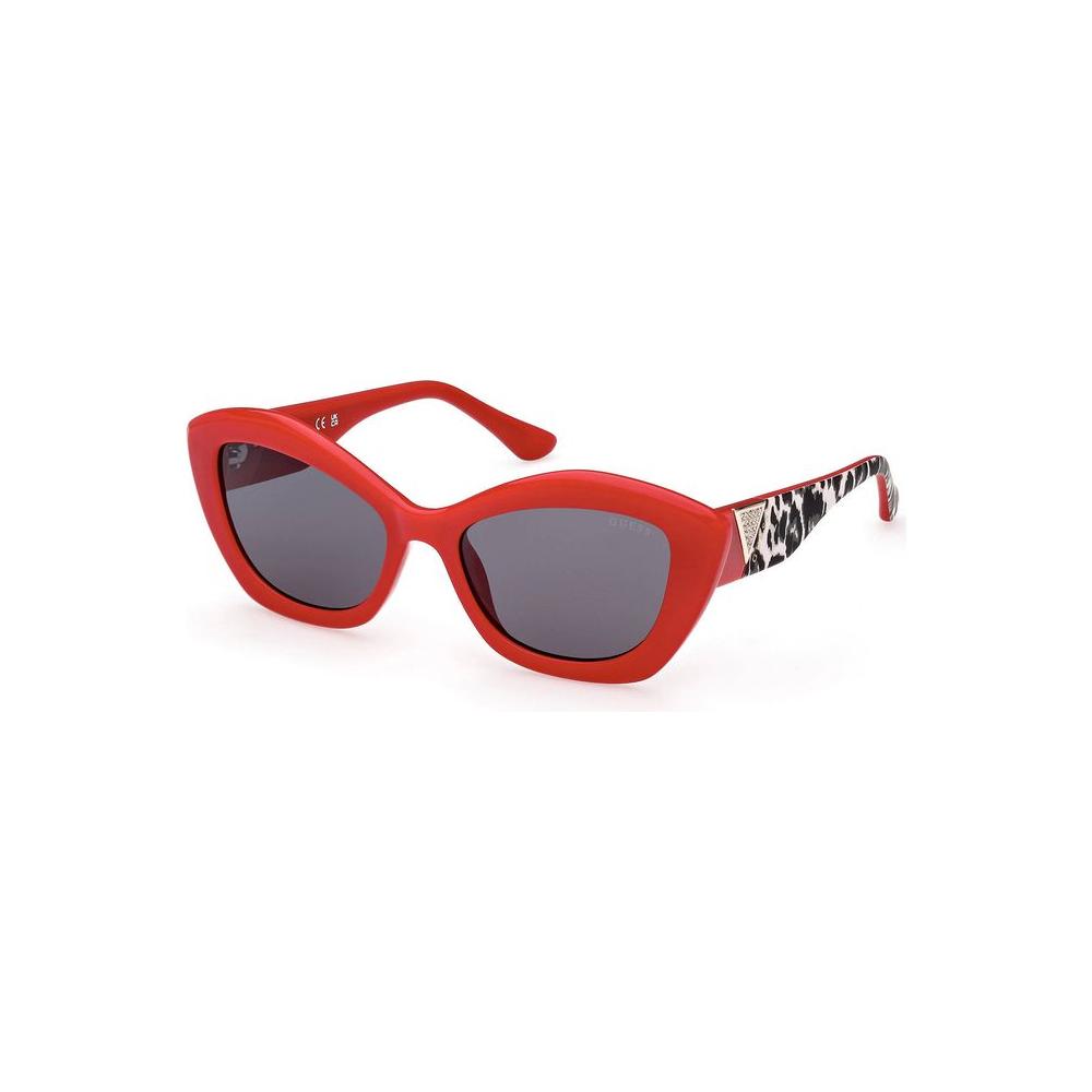 Red Guess Jeans women's sunglasses with black teardrop lenses and patterned sides, perfect for bold fashion styles.