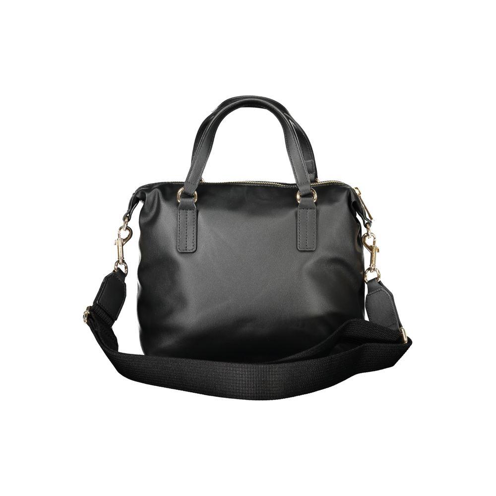Tommy Hilfiger black polyester women's handbag with detachable strap and internal pocket, featuring iconic branding.