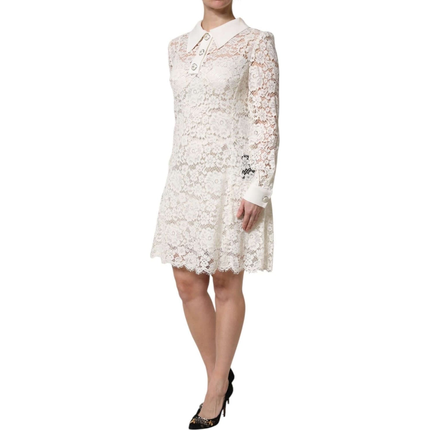 Dolce & Gabbana white floral lace shift dress with long sleeves, detailed collar, and button closure, worn by a model - elegant attire.