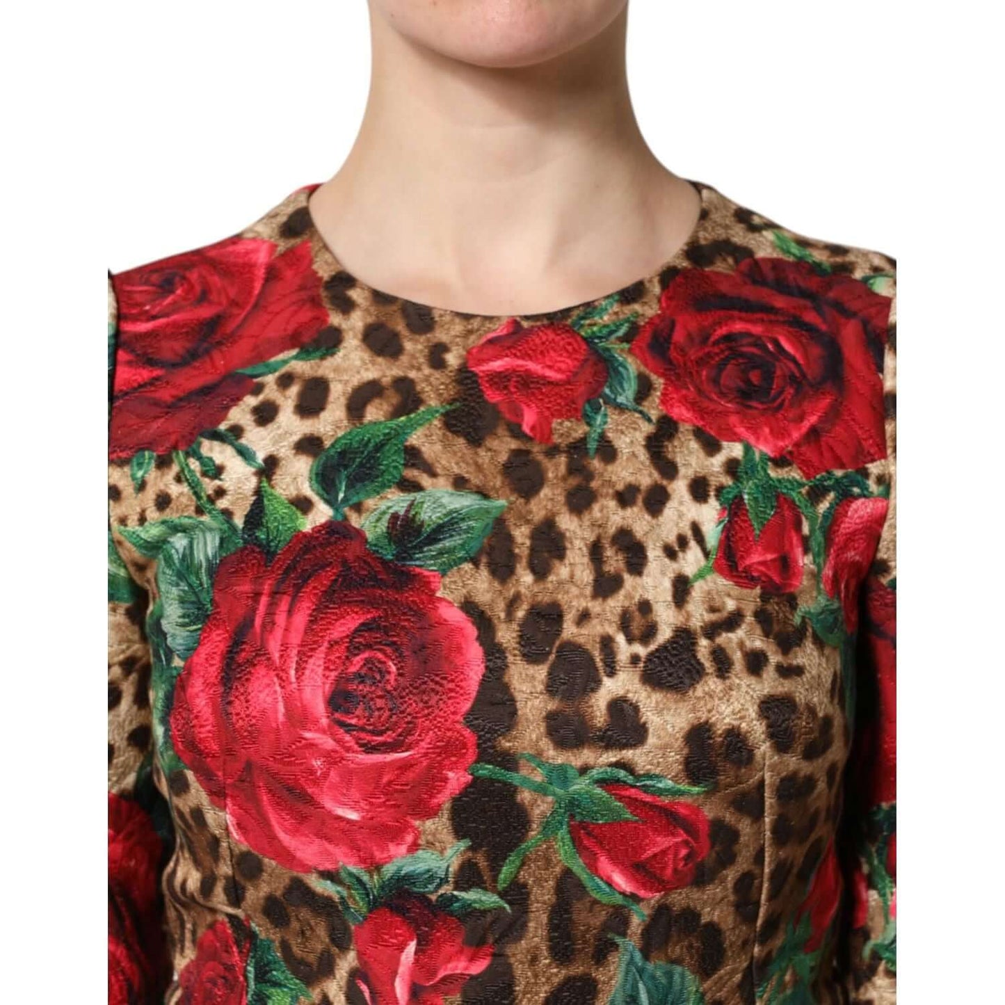 Dolce & Gabbana mini dress with leopard and red rose floral print, close-up of neckline and fabric texture.
