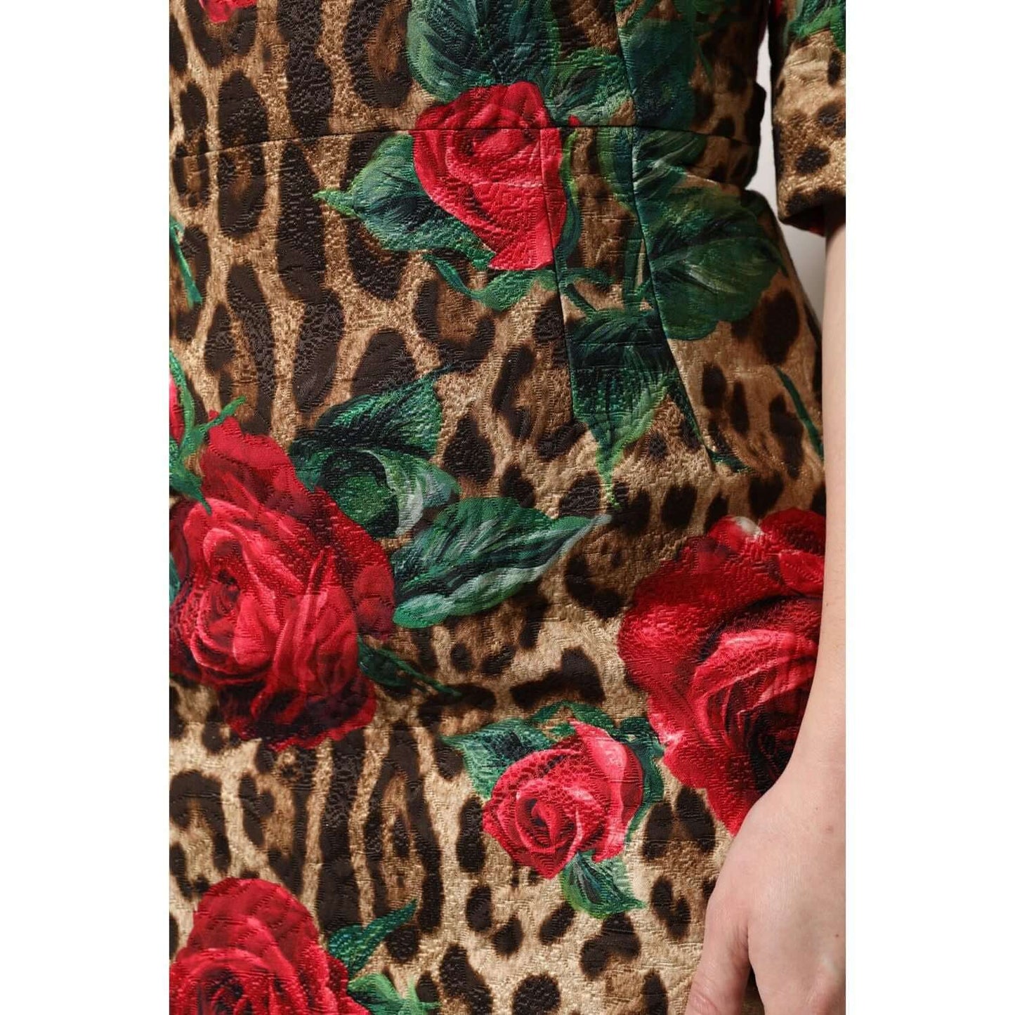 Dolce & Gabbana mini dress with brown leopard print and red rose floral design, 83% cotton, short sleeves, zipper closure.