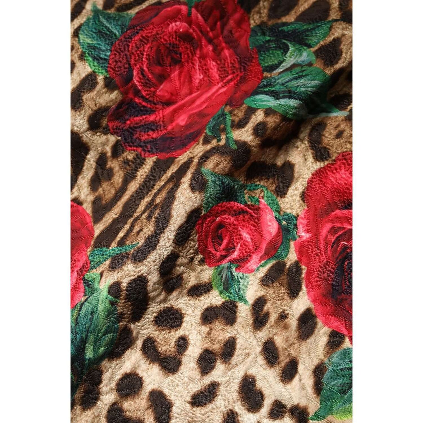 Dolce & Gabbana brown leopard print fabric with red roses and green leaves.
