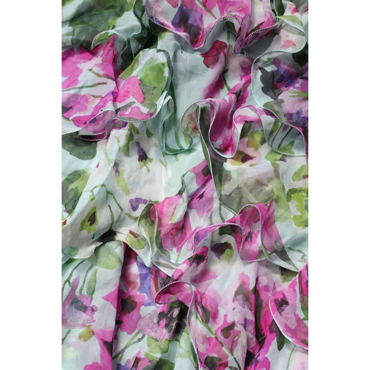 Dolce & Gabbana multicolor floral silk midi dress fabric close-up; luxurious design with vibrant pink and green flowers.